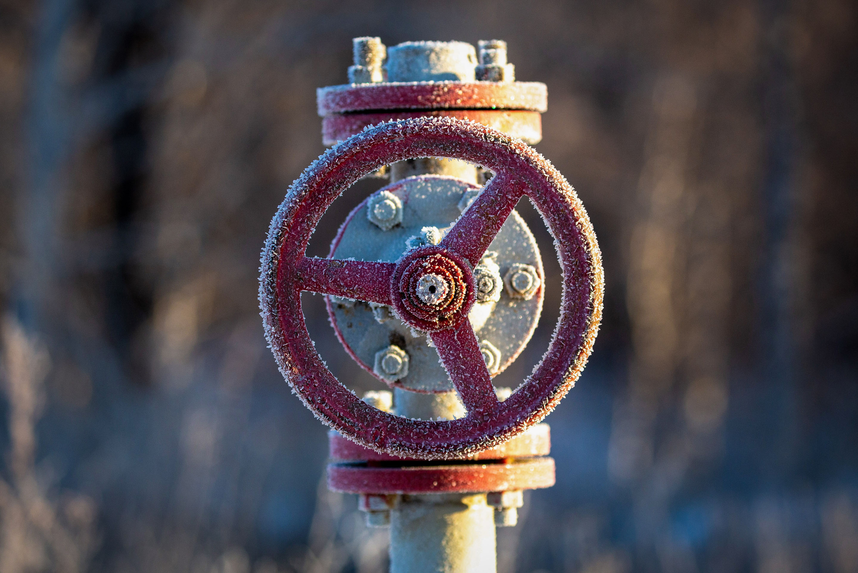 Frost covered red gas pipeline valve